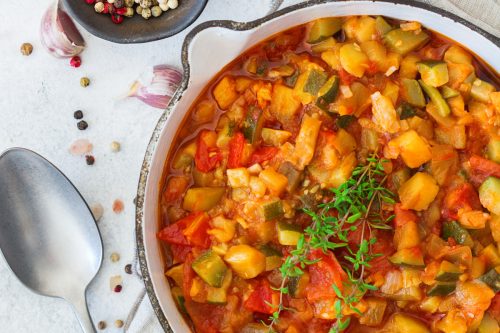 Copper pot with stewed tomatoes