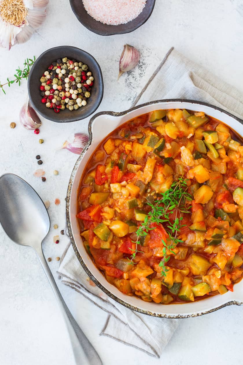 Copper pot with stewed tomatoes
