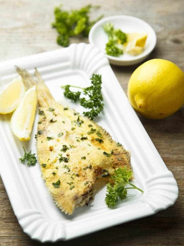 Baked Flounder with Lemon Pepper and Parsley on a platter