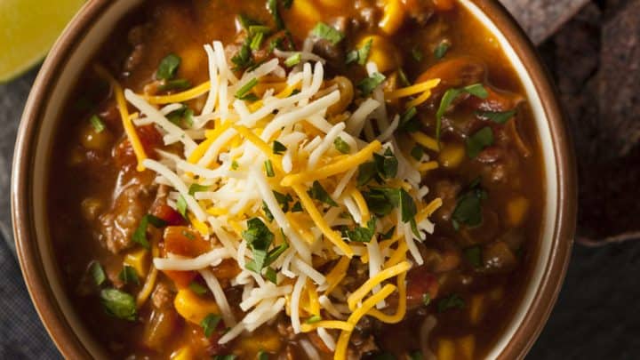 Verticle view of a bowl of chili in a white bowl