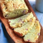 Sliced Ham and Gruyere Quick Break on a wooden serving platter.