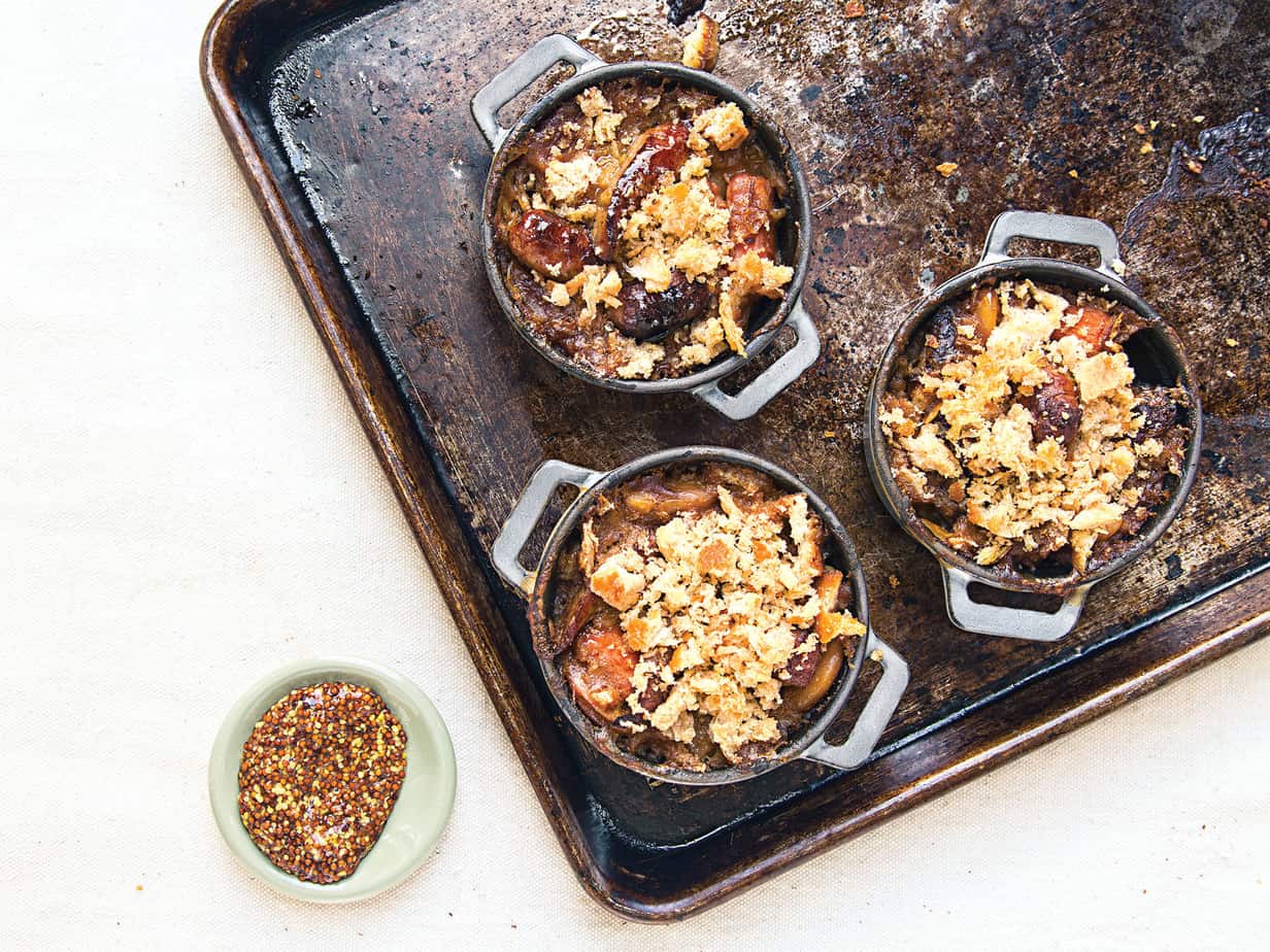 Cast Iron Pots of Bean Sausage Stew on a Baking Sheet