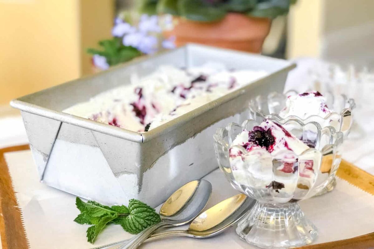Blueberry No Churn Ice Cream in glass dishes and metal loaf pan.