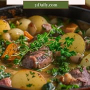 A bowl of Dublin Coddle with sliced potatoes, carrots, sausage, and parsley in a savory broth—a traditional Irish favorite enjoyed on St. Patrick’s Day.