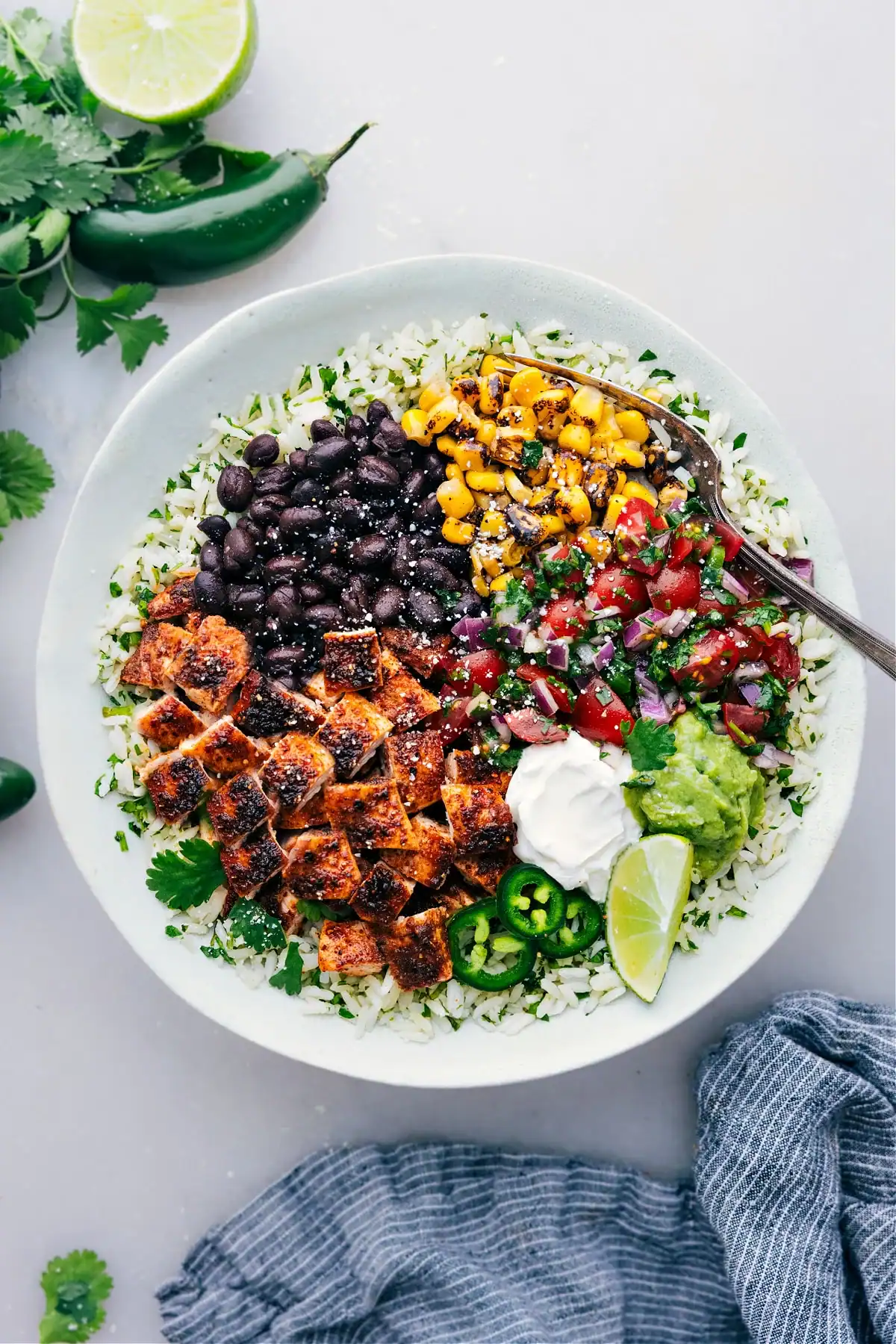 Chicken Burrito Bowl with crispy chicken, black beans and Mexican inspired toppings.