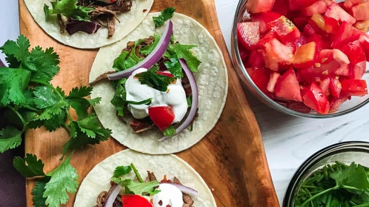 street beef tacos with condiments