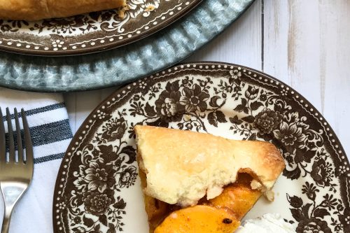 overhead photo of sliced peach galette