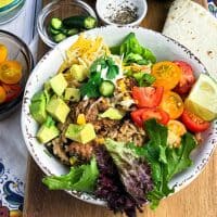 closeup of turkey burrito bowl with lettuce and avocados