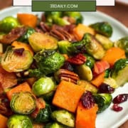 Pinterest Pin image featuring a platter of roasted Brussels Sprouts and the words, "Maple Glazed Brussels Sprouts" and "Easy, Sheetpan, 30 Minutes."