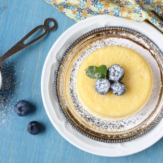Lemon Pudding Cake with Blueberries and Dusted with Confectioners' Sugar