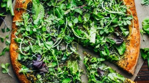 Top view of green pizza for St. Patrick's Day appetizers.