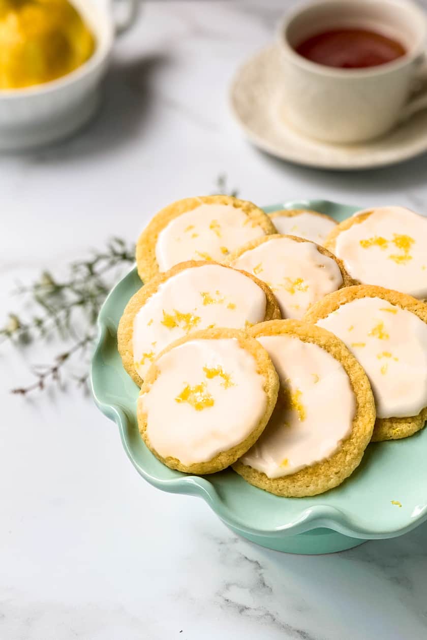 Closeup view of Lemon Tea Cookies with a Cup of Tea