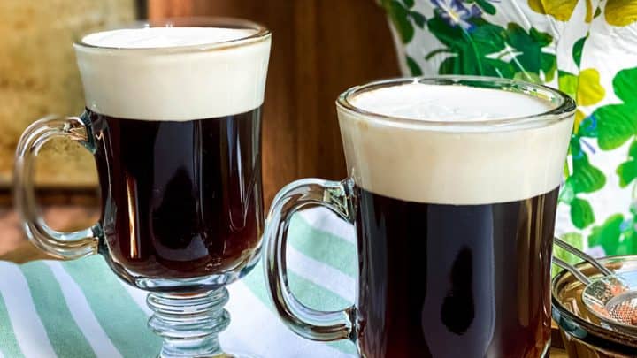 Two Mugs of Irish Coffee on a Green Cloth