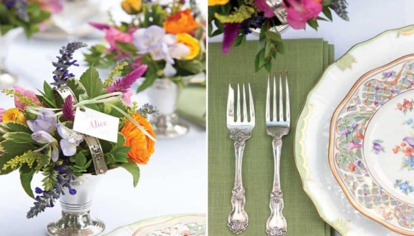 Table setting with floral arrangements, silver cutlery on green napkins, and decorative plates with a floral pattern; the perfect spring afternoon tea, with a name card in one bouquet reading "Alice.