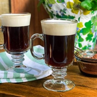 Two Mugs of Irish Coffee on a Wooden Board