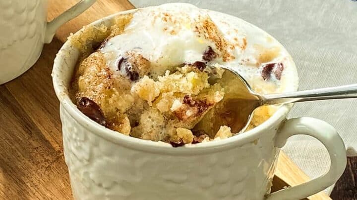 Closeup view of a Chocolate Chip Banana Mug Cake with a Spoon