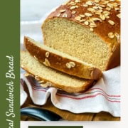 Sliced Honey Oat Sandwich Bread as a Pinterest Pin image.