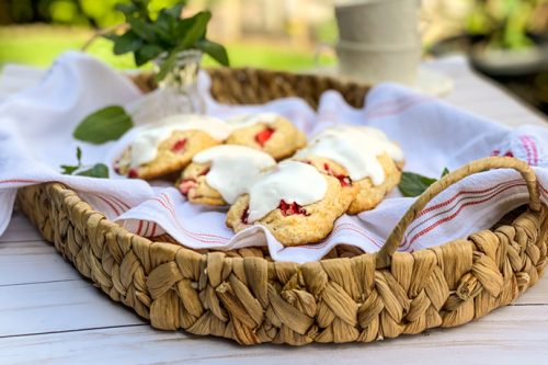 Fresh Strawberry Scones in a Basket Outdoors with Tea