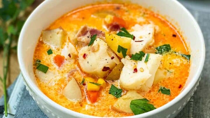 Quick and Easy Fish Chowder in a white bowl on wood cutting board