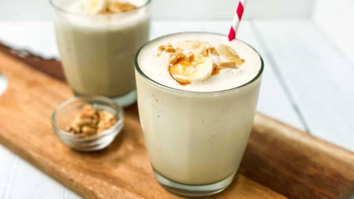 Closeup view of peanut Butter Banana Smoothie topped with bananas and warmed peanut butter