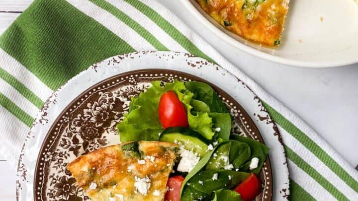 Top view of sliced Easy Crustless Quiche with Bacon, Cheese and Spinach