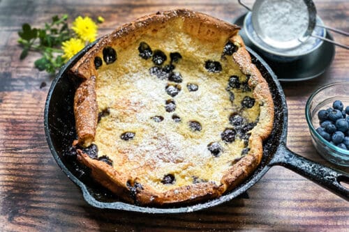 Blueberry Dutch Baby Oven Pancake in a Cast Iron Skillet