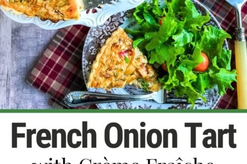 Overhead view of a French onion tart with creamed onion in a white dish, with a slice served on a plate beside a green salad. A pie server, fork, and checkered napkin are visible. Text reads “French Onion Tart with Crème Fraîche.”.