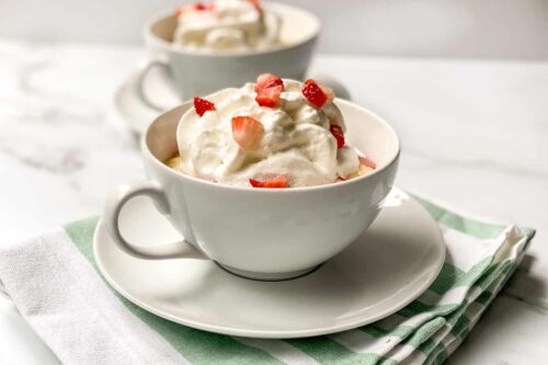 Strawberry Mug Cake with Whipped Cream and Diced Strawberries