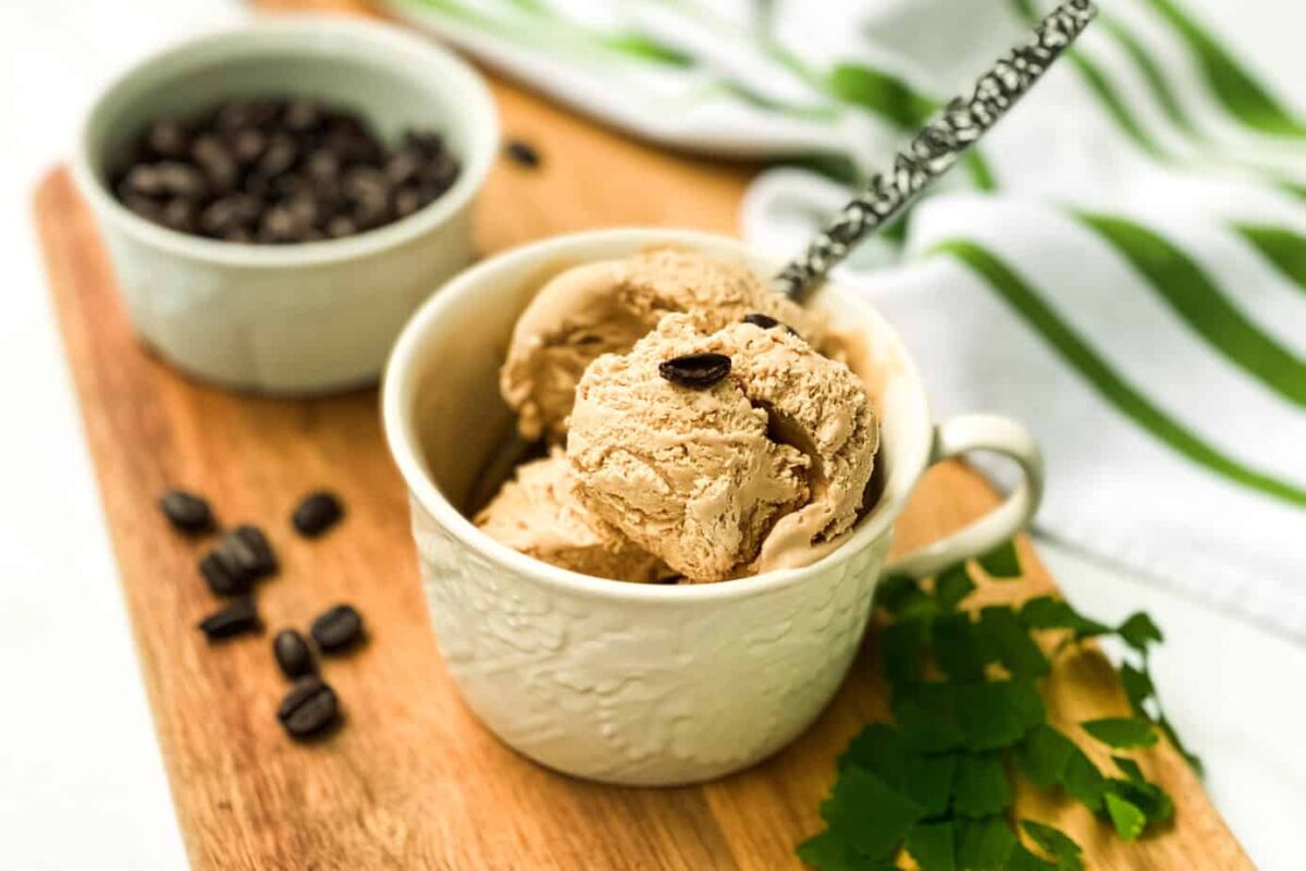 No Churn Irish Coffee Ice Cream in a White Coffee Mug with a Spoon