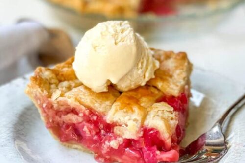 Slice of Rhubarb Pie on a Plate with Vanilla Ice Cream