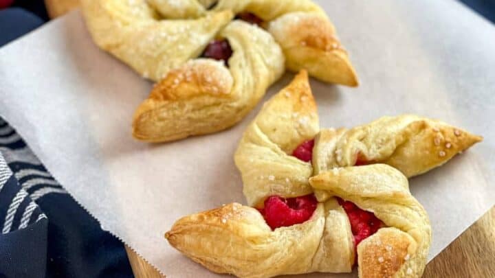 Top view of of a serving of Blueberry Slab Pie on a blue and white striped linen