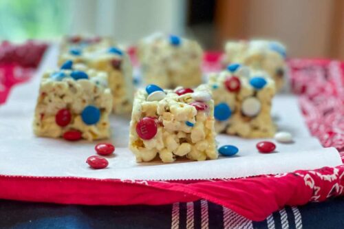 Squares of M&M Popcorn Treats on a Red Bandanna