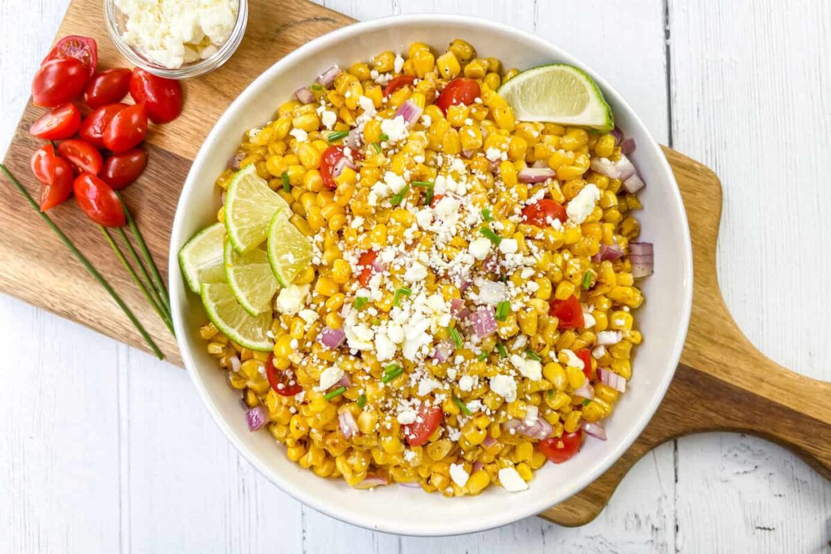 Grilled Corn Salad in a White Bowl with Tomatoes and Feta