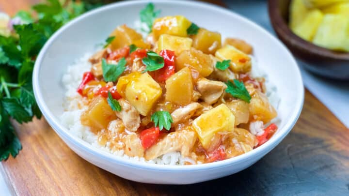 Bowl of Instant Pot Pineapple Chicken over white rice