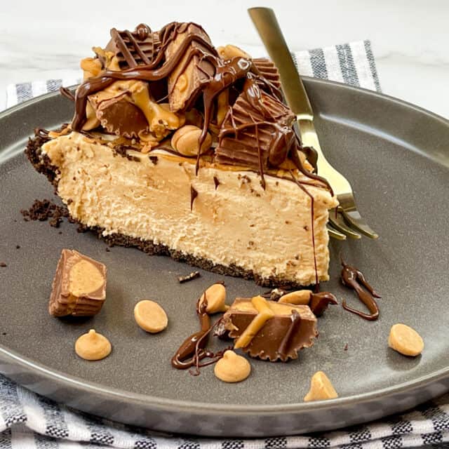 Slice of No Bake Peanut Butter Pie on a dark grey plate.