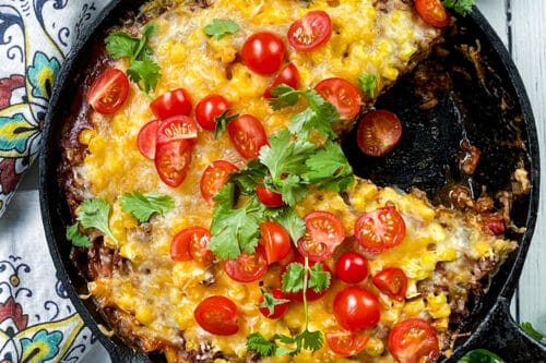 Top view of Mexican Lasagna with wedge missing