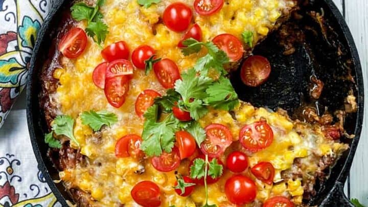 Top view of Mexican Lasagna with wedge missing