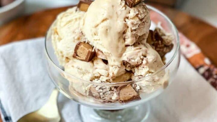 Glass dish with No Churn Peanut Butter Chocolate Ice Cream and mini chocolate peanut butter cups
