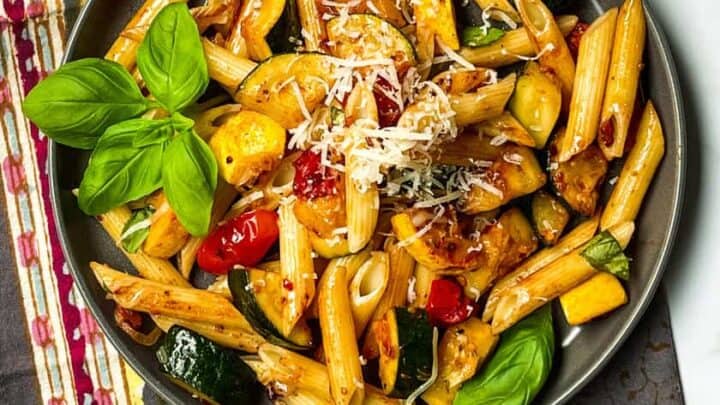 Distant top view of zucchini pasta with fresh basil