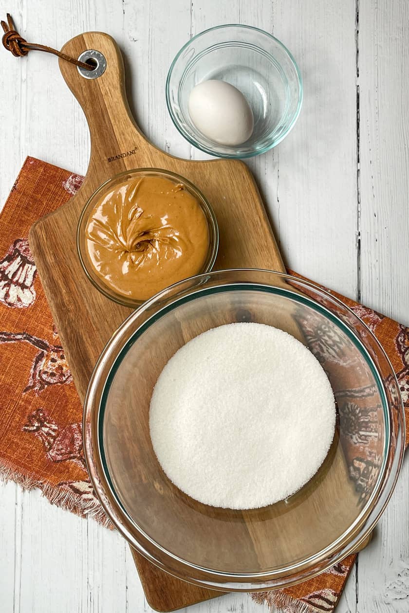 3 Ingredient Peanut Butter Cookies ingredients on a wood cutting board