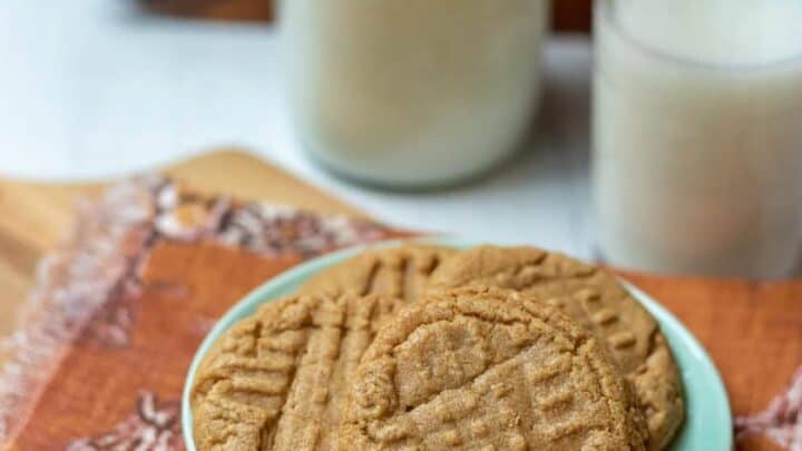 Top view of a plate of 3 Ingredient Peanut Butter Cookies with a glass of milk