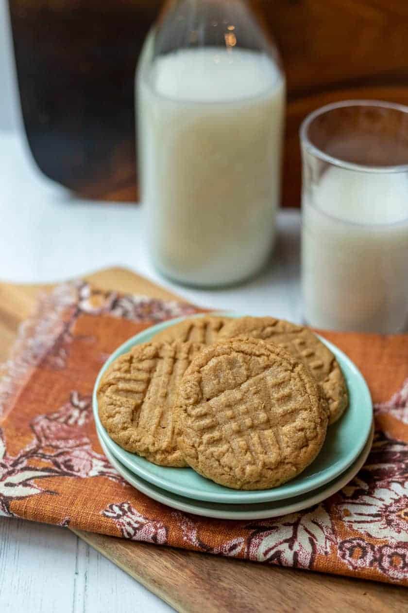 Top view of a plate of 3 Ingredient Peanut Butter Cookies with a glass of milk