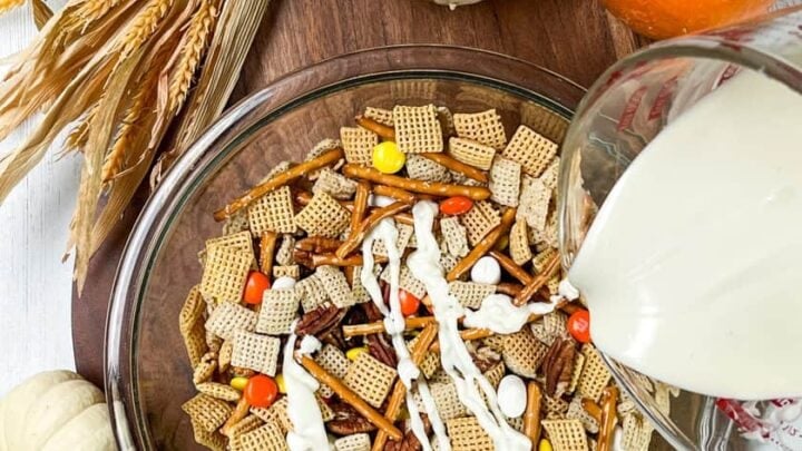 Bowl of Fall Crack Chex Mix with melted white chocolate