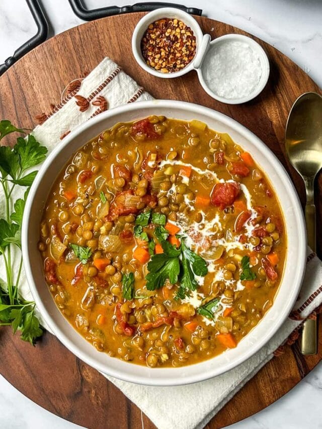 Top view of Curry Lentil Soup with fresh parsley and coconut milk