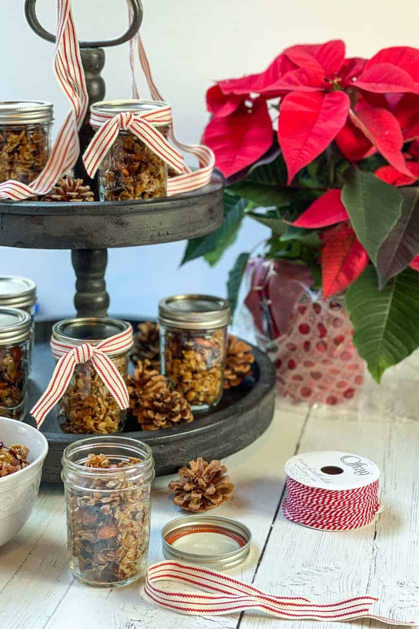 Jars of Christmas Granola with red and white ribbon