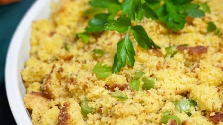 Closeup view of Cornbread Dressing in a white casserole dish