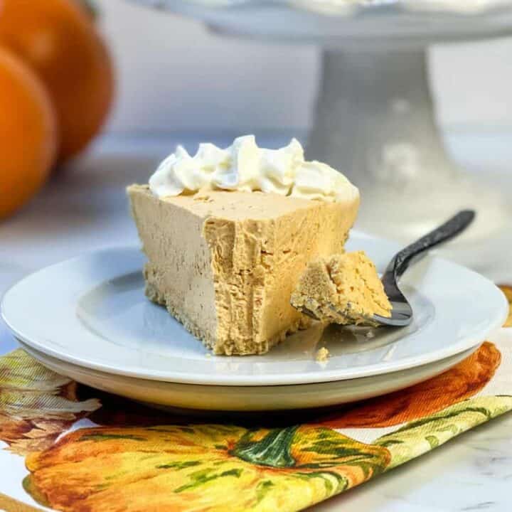 Slice of No Bake Pumpkin Cheesecake with a bite missing