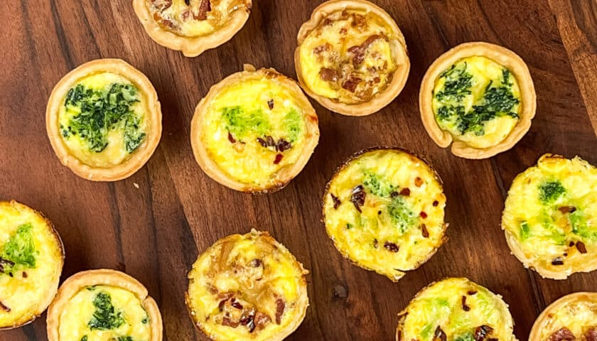 Party style Mini Quiche on a wood serving board