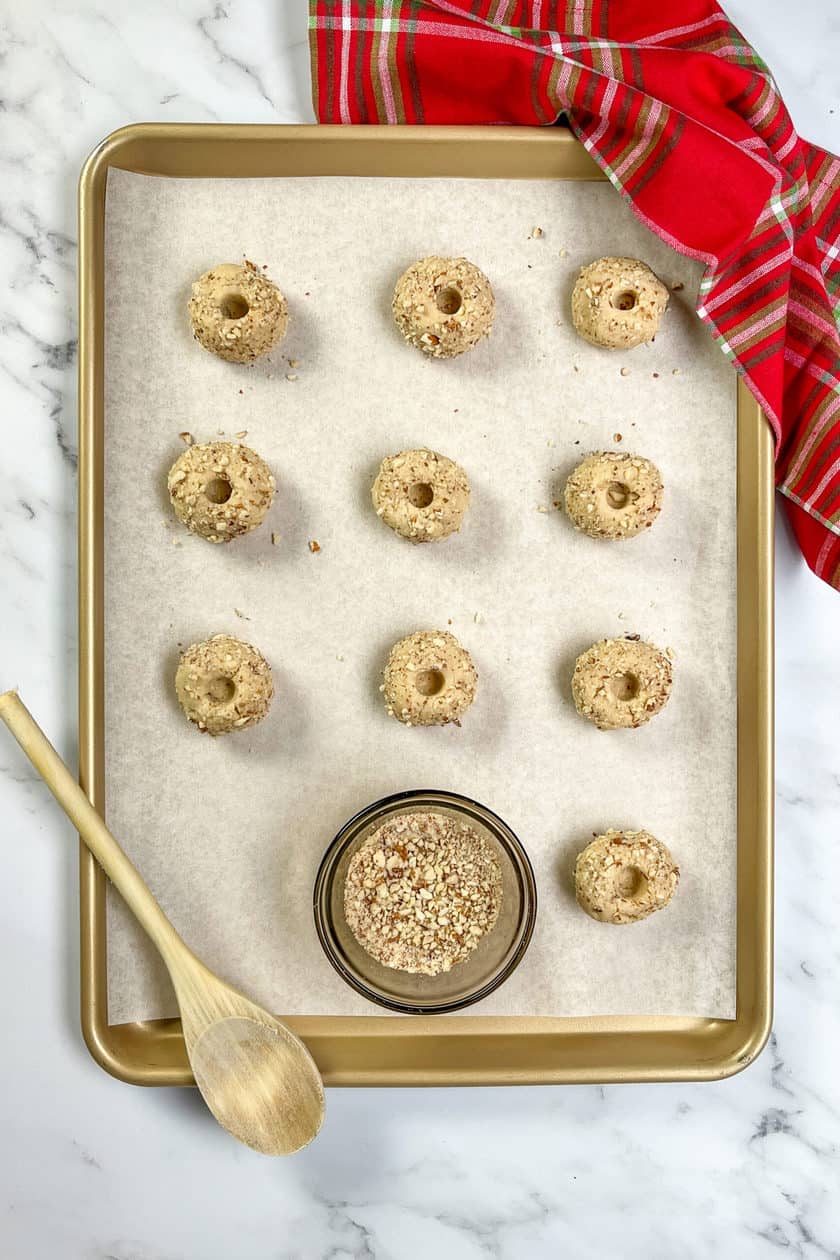 Unbaked Thumbprint Cookie dough balls with indentations for jam