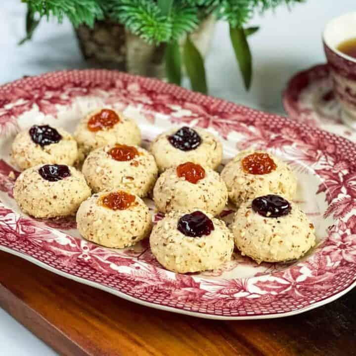 Thumbprint cookies on a red and white platter